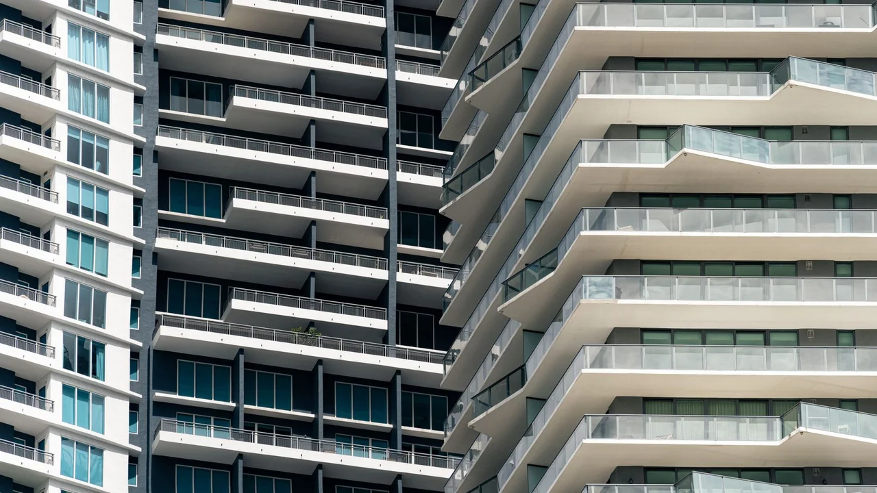 Close-up view of contemporary skyscrapers in Miami, showcasing geometric balconies and urban design.