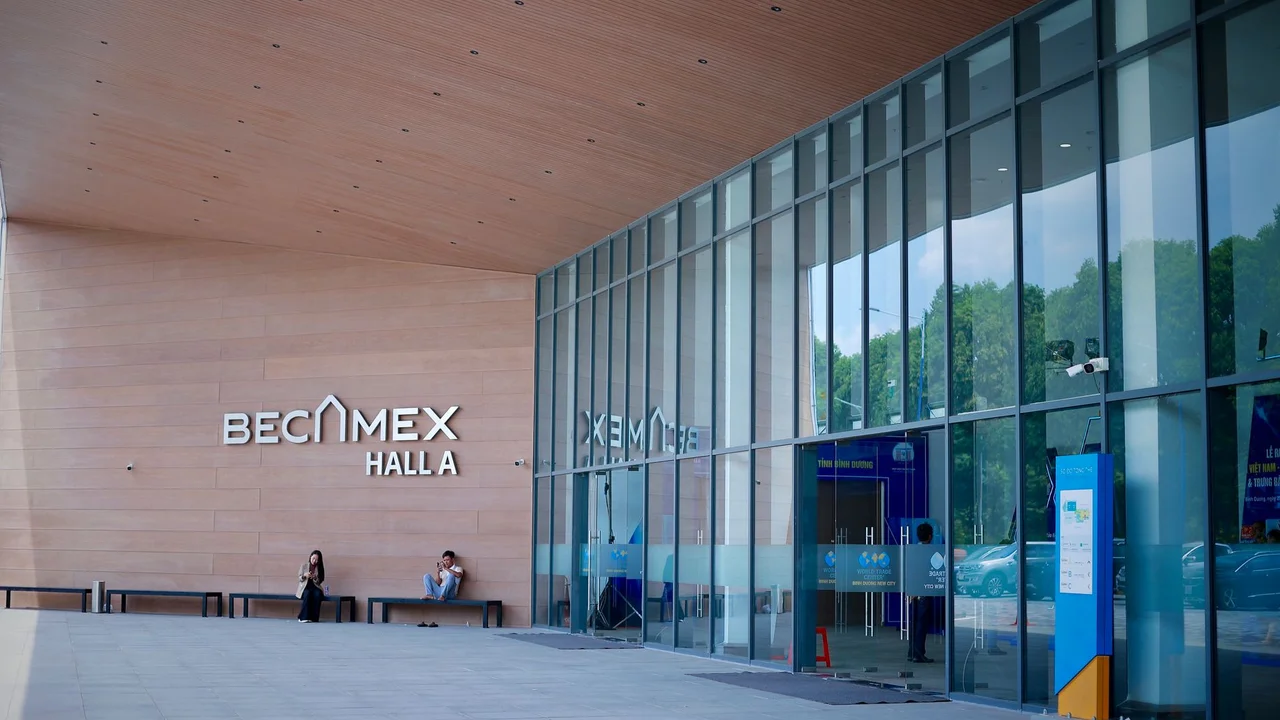Exterior view of Becamex Hall A with a glass facade and contemporary design.