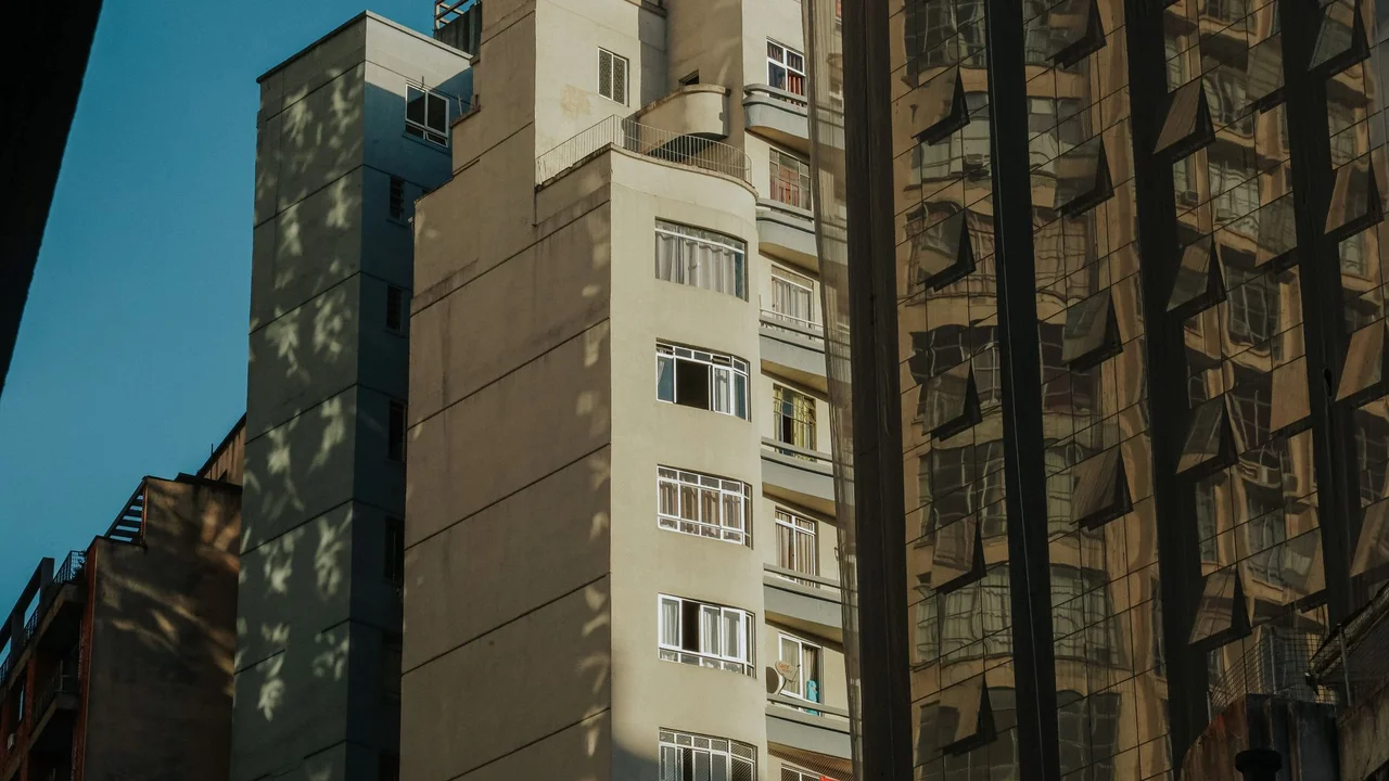Modern urban architecture reflecting in glass surfaces in downtown Curitiba, Brazil.