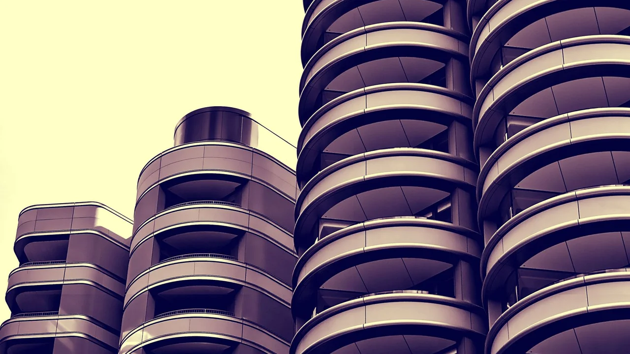 Stylish urban skyscraper perspective with circular balcony design and modern architecture.