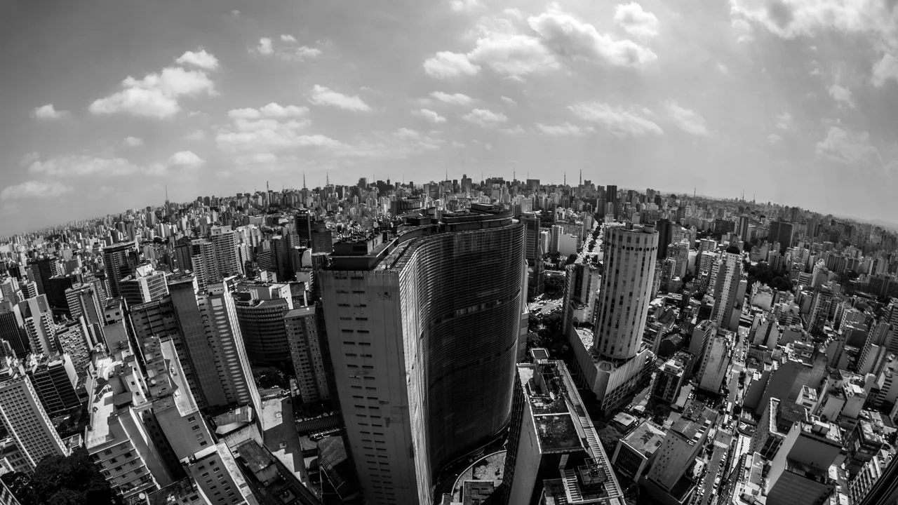 Stunning aerial view of São Paulo's skyline in black and white, highlighting its urban density and architecture.